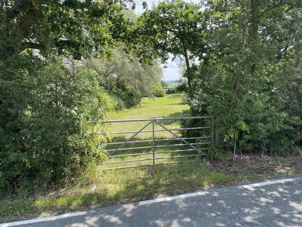 Lot: 46 - JUST OVER AN ACRE OF FREEHOLD LAND WITH POTENTIAL FOR VARIETY OF USES - External view of the gated access point